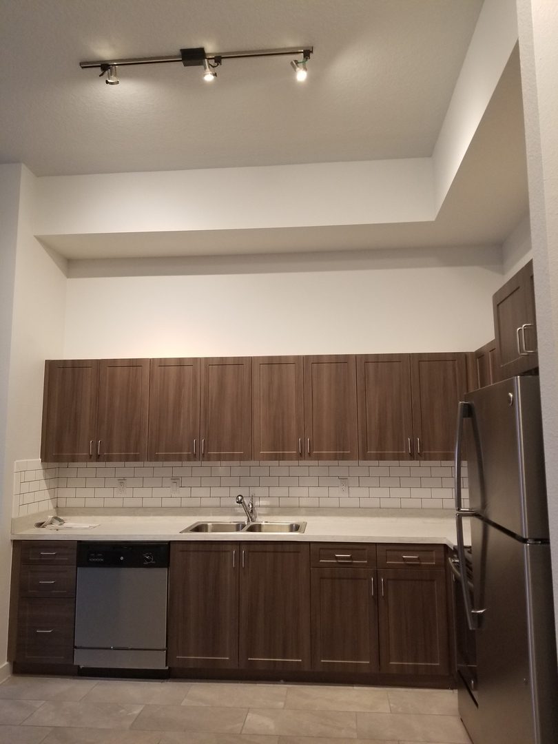 Spacious kitchen with overhead lighting