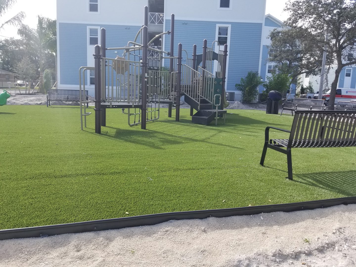 Playground with artificial grass and benches